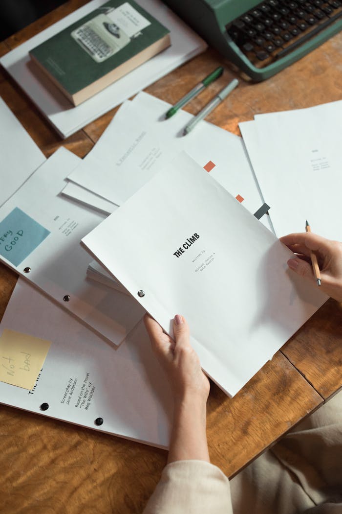 Close-Up Shot of a Person Holding Documents